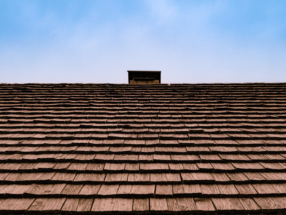 New roof with chimney against a blue sky